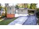 Charming home featuring brick foundation and a convenient carport at 2020 Kenwood Se Pl, Smyrna, GA 30082