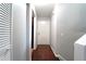 Bright hallway with hardwood floors, neutral walls, and a white door, creating a welcoming entrance at 2020 Kenwood Se Pl, Smyrna, GA 30082