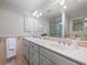 Bathroom featuring double vanity sinks, large mirror, soaking tub, and walk-in shower at 2049 Castleway Ne Ln, Atlanta, GA 30345