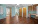 Bedroom with attached bath, built-in desk, drawers and cabinets, and hardwood floors at 2049 Castleway Ne Ln, Atlanta, GA 30345