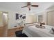 Neutral bedroom features hardwood floors, a ceiling fan, and natural light at 2049 Castleway Ne Ln, Atlanta, GA 30345