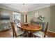 Elegant dining room featuring a chandelier and access to the kitchen at 2049 Castleway Ne Ln, Atlanta, GA 30345