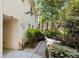 Charming brick home with well-maintained landscaping and a stone pathway leading to a bench at 2049 Castleway Ne Ln, Atlanta, GA 30345