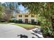 Two-story brick home with white columns, manicured lawn, and mature trees at 2049 Castleway Ne Ln, Atlanta, GA 30345