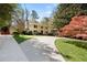 Traditional two-story home with a circular driveway and mature landscaping at 2049 Castleway Ne Ln, Atlanta, GA 30345