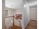 Hallway with wood floors, staircase, and closet at 2049 Castleway Ne Ln, Atlanta, GA 30345