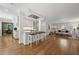 Modern kitchen with stainless steel appliances, an island with bar seating, and hardwood floors at 2049 Castleway Ne Ln, Atlanta, GA 30345