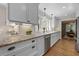 Kitchen with white cabinets, granite countertops, stainless steel appliances, and hardwood flooring at 2049 Castleway Ne Ln, Atlanta, GA 30345