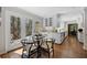 Eat-in kitchen featuring glass table and chairs, french doors, white cabinets, and hardwood flooring at 2049 Castleway Ne Ln, Atlanta, GA 30345