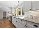 Bright kitchen featuring granite countertops, white cabinets, a undermount sink and stainless steel dishwasher at 2049 Castleway Ne Ln, Atlanta, GA 30345
