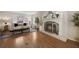 Cozy living room with fireplace, hardwood floors, white mantel, and a neutral color scheme at 2049 Castleway Ne Ln, Atlanta, GA 30345