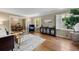 Cozy living room with hardwood floors, shuttered windows, and elegant furnishings at 2049 Castleway Ne Ln, Atlanta, GA 30345