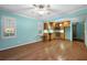 Living room featuring hardwood floors, lots of windows, and a view into the eat-in kitchen at 2049 Castleway Ne Ln, Atlanta, GA 30345