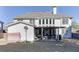 The backyard features a covered patio, a detached garage, and a basketball hoop at 2546 Summer Song Way, Buford, GA 30519