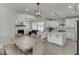 Open-concept kitchen features custom cabinets, quartz countertops, stainless appliances, and a breakfast nook at 2546 Summer Song Way, Buford, GA 30519