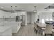 Modern kitchen with stainless appliances, a large island, and a view of the breakfast nook at 2546 Summer Song Way, Buford, GA 30519