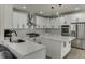 Modern kitchen with a large island, stainless steel appliances, and custom cabinets at 2546 Summer Song Way, Buford, GA 30519
