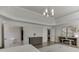 Spacious main bedroom with a decorative tray ceiling, hardwood floors, and an en-suite bathroom and closet at 2546 Summer Song Way, Buford, GA 30519