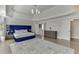 This main bedroom features hardwood floors, neutral walls, a tray ceiling, and an ensuite bathroom at 2546 Summer Song Way, Buford, GA 30519