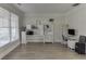 Bright home office with natural light, wood floors, built-in shelving, and a comfortable workspace at 2546 Summer Song Way, Buford, GA 30519
