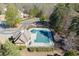 Community pool area with chairs, playground, and surrounded by a lot of mature trees at 2546 Summer Song Way, Buford, GA 30519