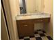 Bathroom featuring a vanity with a blue countertop and black and white checkered floor at 3788 Travis Trce, Decatur, GA 30032