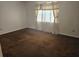 Spacious bedroom featuring a large window with curtains and neutral wall colors at 3788 Travis Trce, Decatur, GA 30032