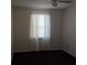 Bedroom featuring a ceiling fan and a window with white curtains at 3788 Travis Trce, Decatur, GA 30032