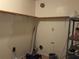 The laundry room features built-in shelving and utility connections for laundry appliances at 3788 Travis Trce, Decatur, GA 30032