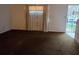 Spacious living room features neutral walls, carpeted flooring, and a large window with natural light at 3788 Travis Trce, Decatur, GA 30032