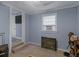 Cozy bedroom with a window unit, neutral carpet, and a doorway to another room at 1202 Coan Dr, Locust Grove, GA 30248