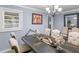 Traditional dining room with a large table, comfortable chairs, chandelier and elegant details at 1202 Coan Dr, Locust Grove, GA 30248