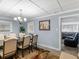 Traditional dining room with a large table, comfortable chairs, and view to the living room at 1202 Coan Dr, Locust Grove, GA 30248
