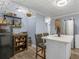A cozy kitchen with an island, white cabinets, and stainless steel appliances at 1202 Coan Dr, Locust Grove, GA 30248