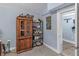 Office space featuring shelving, artwork, decor, and an open doorway at 1202 Coan Dr, Locust Grove, GA 30248
