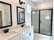 Primary bathroom boasts double sinks, modern fixtures, and a luxurious glass enclosed shower at 1826 Butterfly Way, Marietta, GA 30066