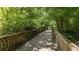 Picturesque wooden bridge surrounded by lush greenery, offering a peaceful natural escape at 1826 Butterfly Way, Marietta, GA 30066