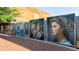 Downtown murals exhibited on a fence, displaying local art at 1826 Butterfly Way, Marietta, GA 30066