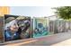 Street view of downtown murals exhibited on a fence in the city at 1826 Butterfly Way, Marietta, GA 30066