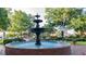 Downtown water fountain surrounded by brick, benches, and greenery at 1826 Butterfly Way, Marietta, GA 30066