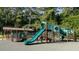 Community playground with slides, climbing structures, and ample green space for recreational activities at 1826 Butterfly Way, Marietta, GA 30066