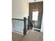 Stylish staircase with contemporary design elements and a decorative light fixture at 1826 Butterfly Way, Marietta, GA 30066
