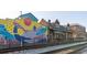 Marietta Welcome Center by art mural, offering a delightful welcome to visitors with a vibrant mural at 1826 Butterfly Way, Marietta, GA 30066