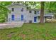 A view of the home's exterior shows a cozy backyard with a two-story layout and a deck at 2270 Cresta Dr, Decatur, GA 30032