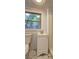 Compact bathroom with a window, toilet, sink and shower at 2270 Cresta Dr, Decatur, GA 30032
