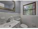 Bathroom featuring white tile, neutral walls, and a large window at 2270 Cresta Dr, Decatur, GA 30032