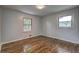 Cozy bedroom with hardwood floors, natural light from the windows, and painted walls at 2270 Cresta Dr, Decatur, GA 30032