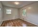 Bedroom featuring beautiful hardwood floors and natural light coming in from two windows at 2270 Cresta Dr, Decatur, GA 30032