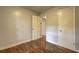 Bright bedroom featuring hardwood floors, neutral paint, and ample closet space at 2270 Cresta Dr, Decatur, GA 30032