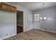 Dining Room featuring laminate floors, door to outside, and modern hanging light fixture at 2270 Cresta Dr, Decatur, GA 30032